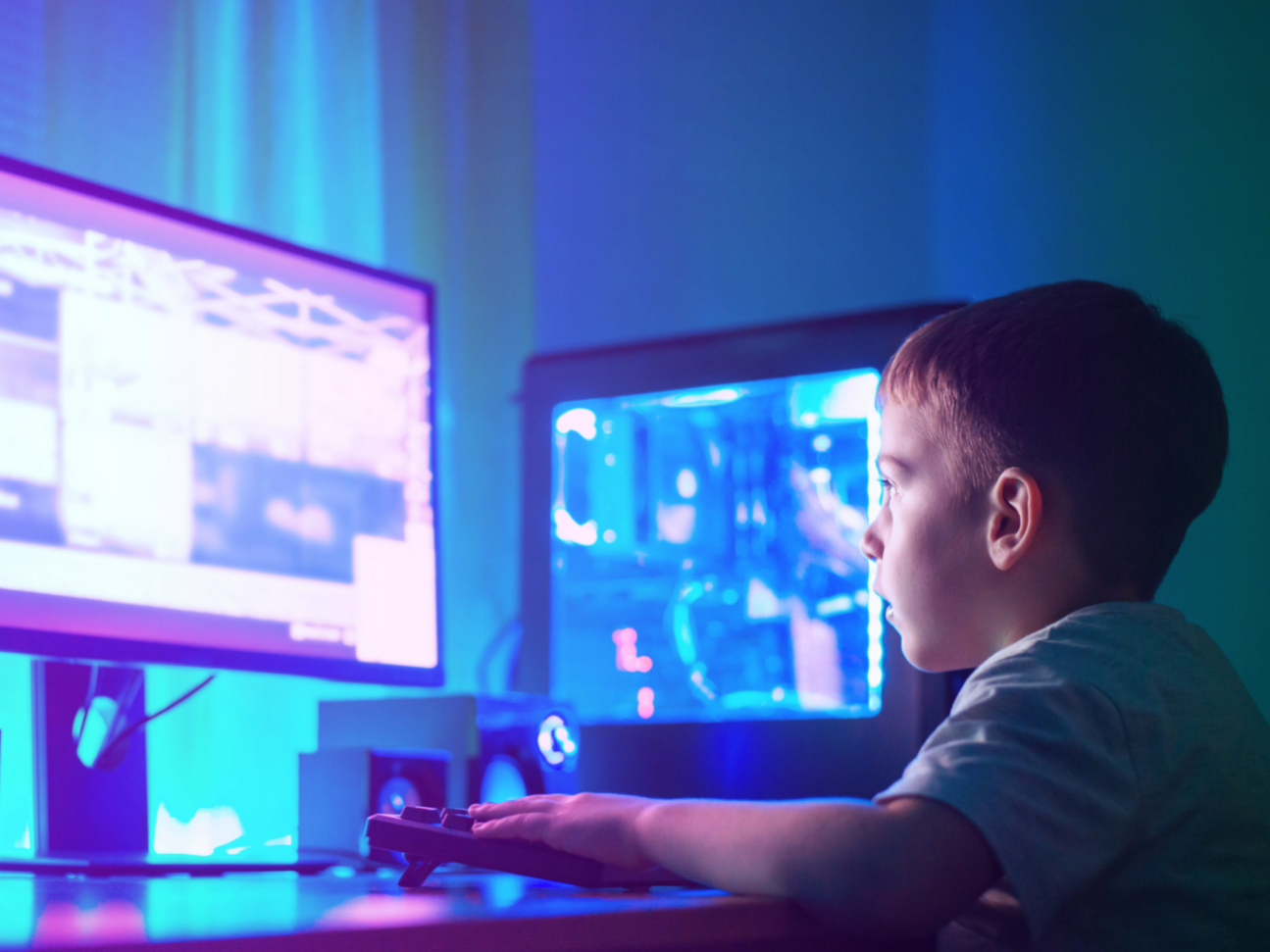 Boy and blue/purple computer