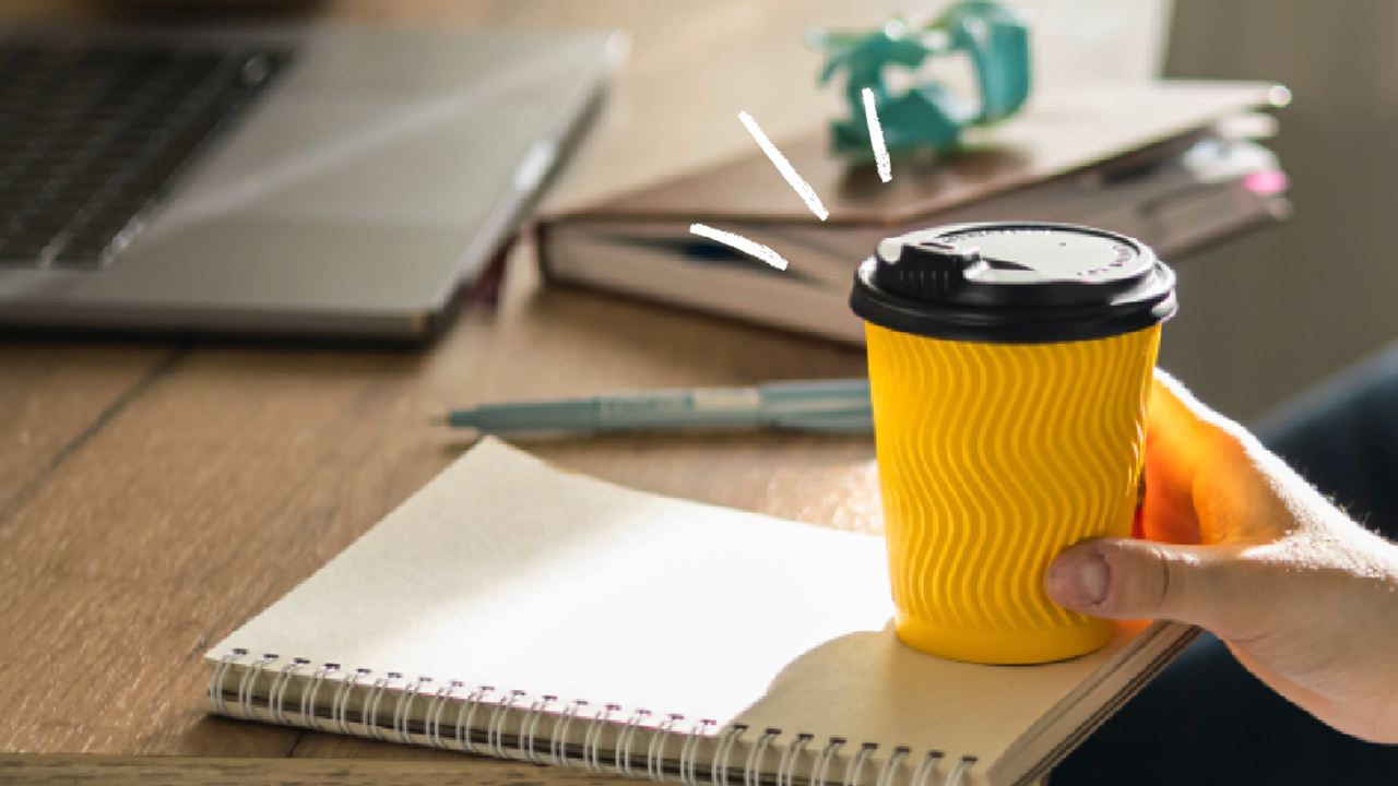 Coffee cup and notepad