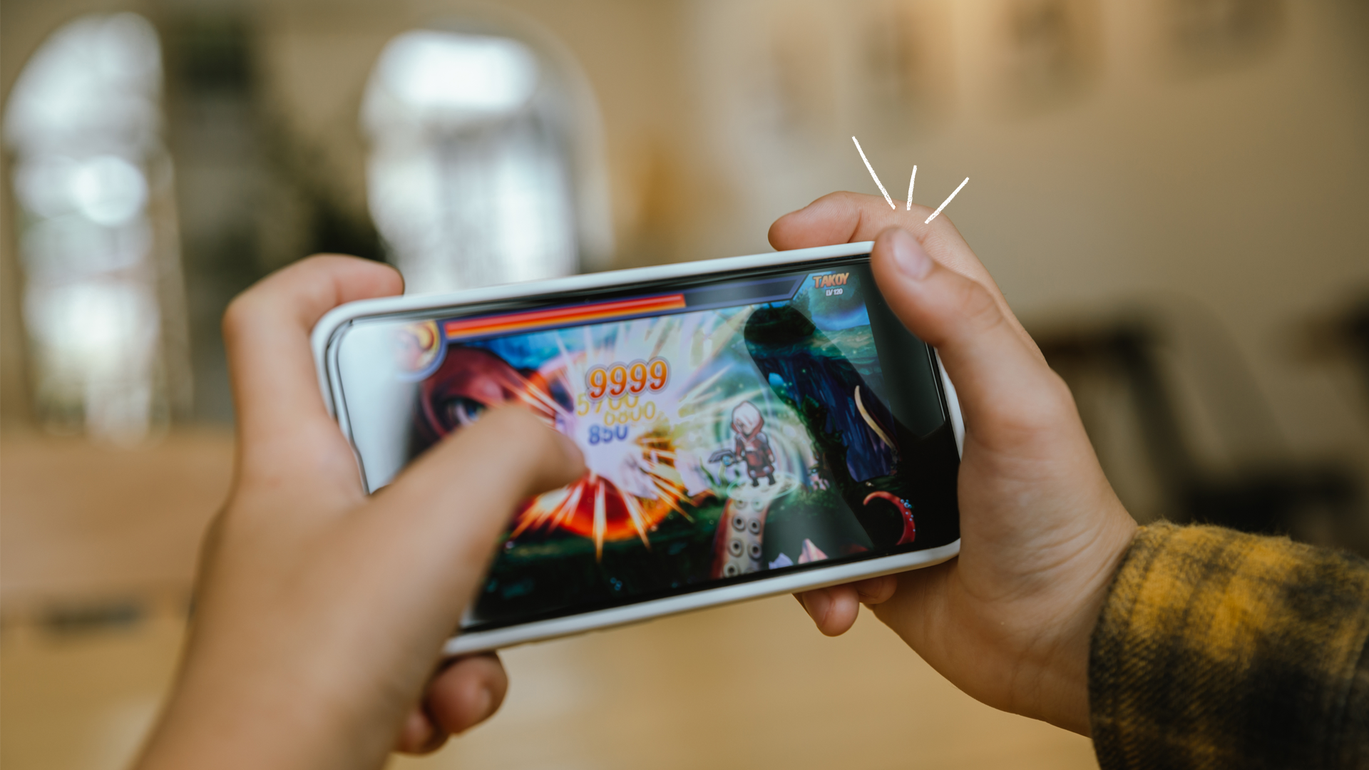 Person playing game on phone