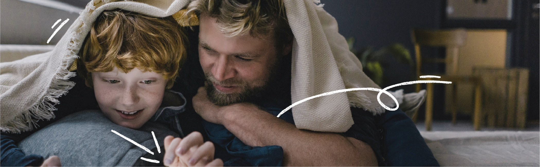 Father and son watching screen