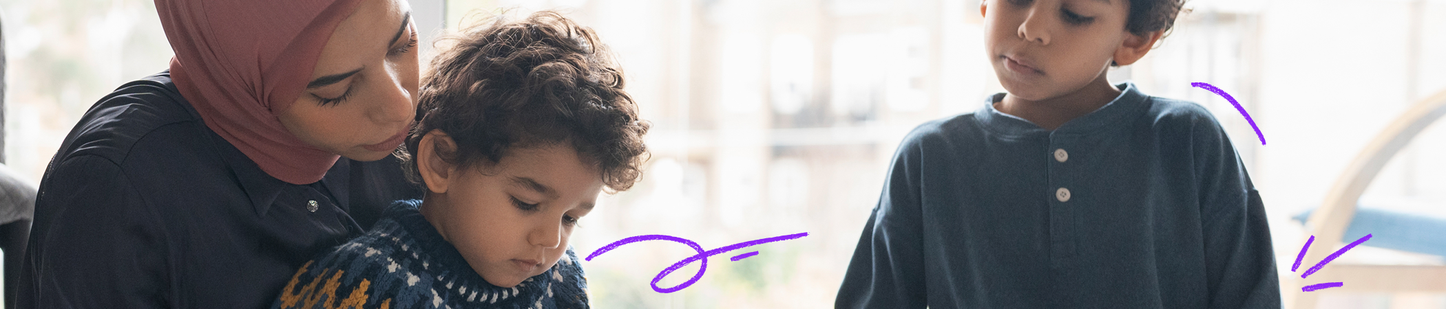 Mother with son using device