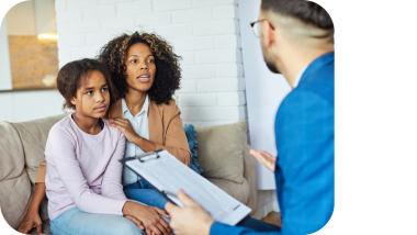 Parent and teen talking to professional