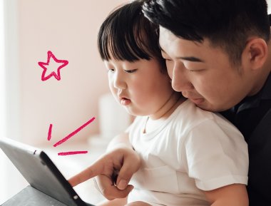 Father and daughter looking at tablet screen