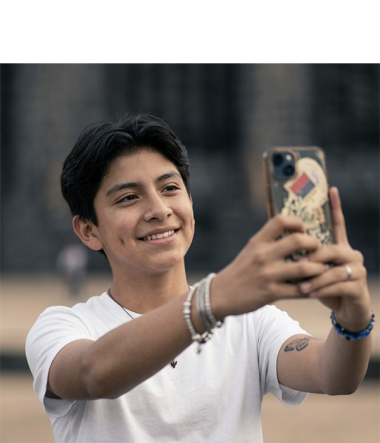 Teen smiling taking selfie