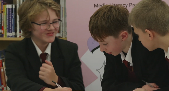 Secondary school students smiling