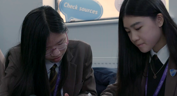 Two secondary school students in classroom